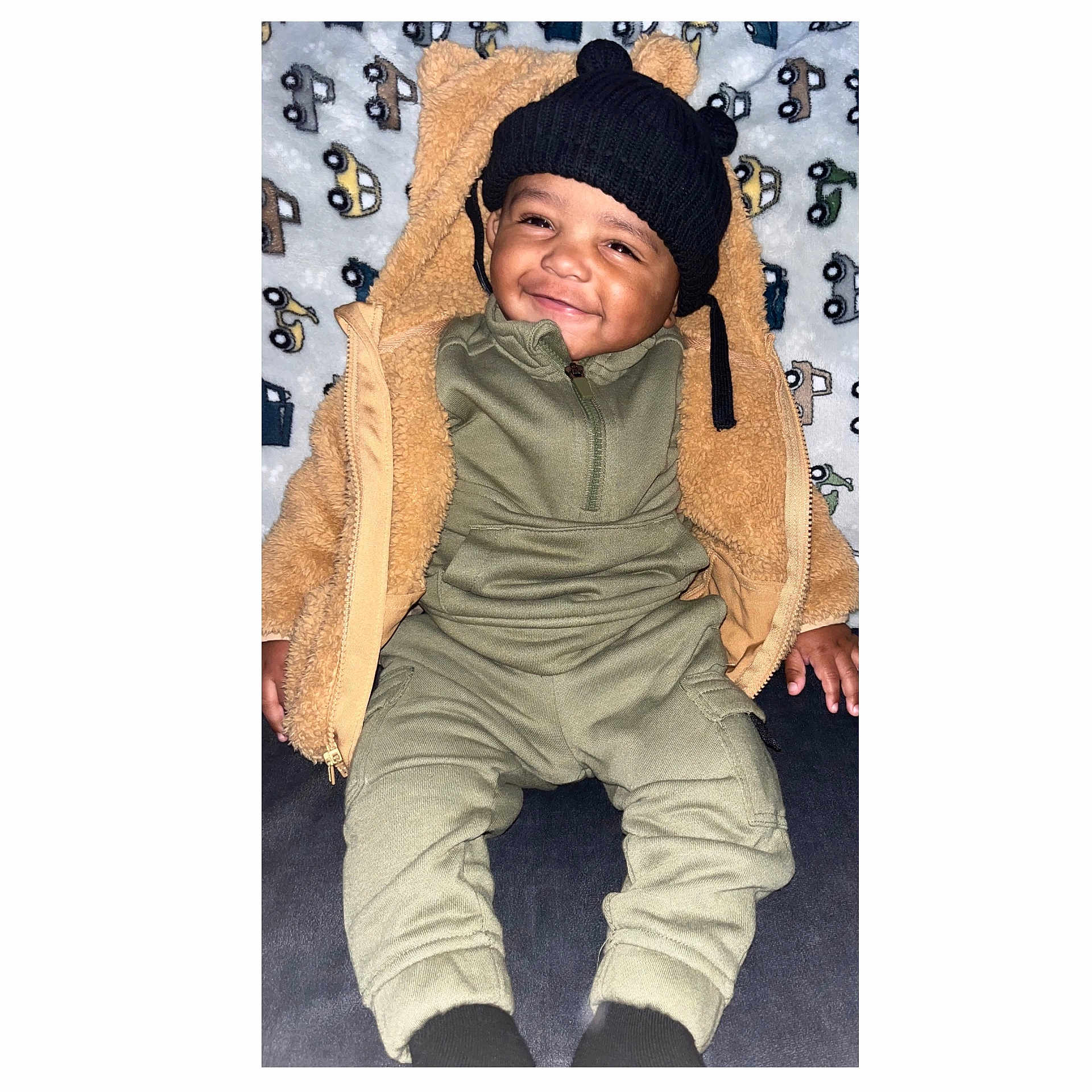 Quinn joined the competition — help win amazing prizes! baby, beanie, blanket, bonnet, cap, clothing, coat, face, glove, happy, hat, head, hood, jacket, pants, person, photography, portrait, sleeping, smile