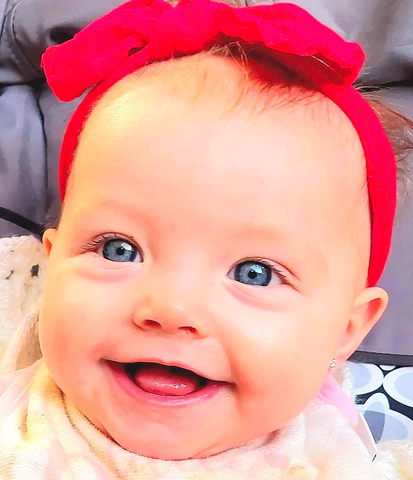 Dixie is registered to the contest to win money with this photo: cheek, chin, eye, eyebrow, eyelash, face, facial_expression, happy, head, human, iris, joy, lip, mouth, nose, organ, outerwear, person, photograph, skin