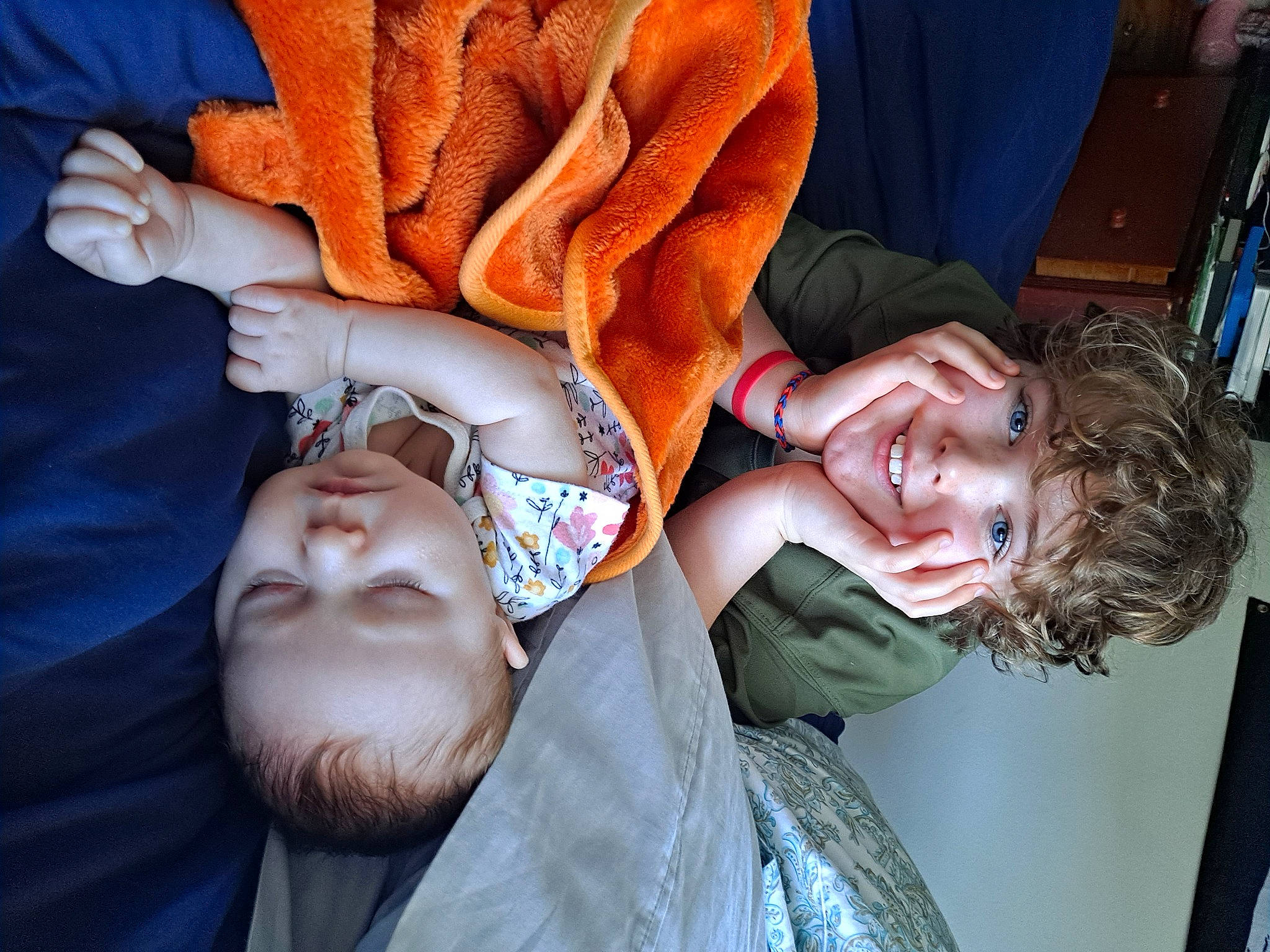 Chayton is registered to the contest to win money with this photo: beard, child, comfort, event, facial_expression, finger, fun, gesture, happy, joy, mouth, nail, pattern, peach, person, petal, rose, rose_family, rose_order, textile