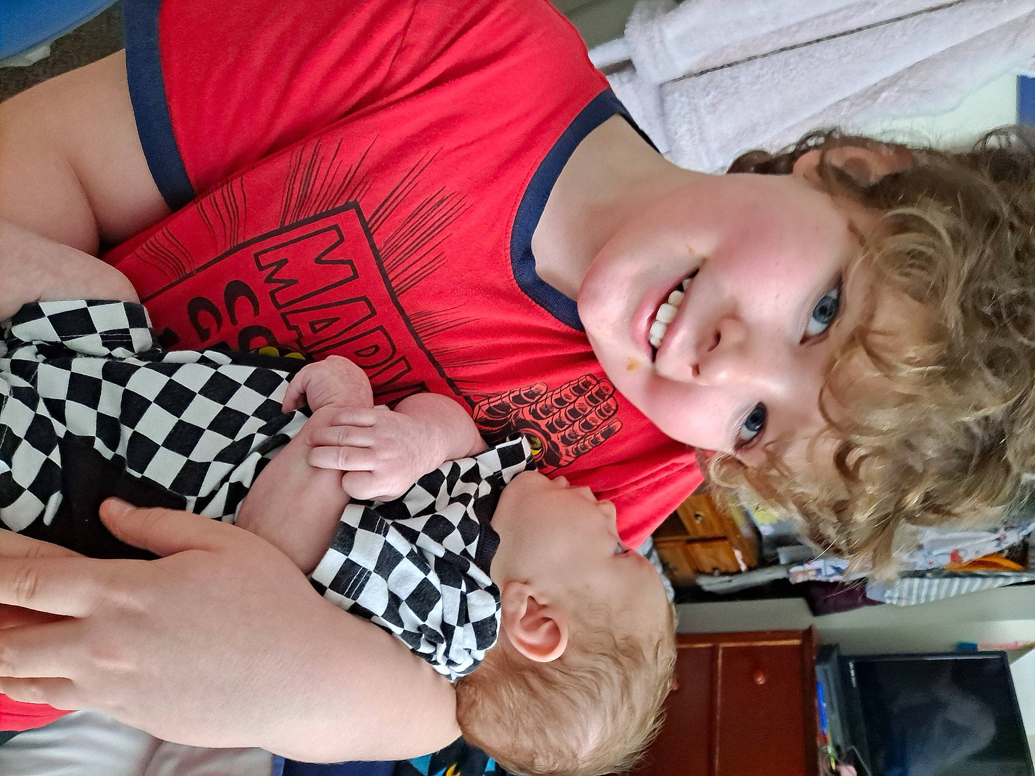 Chayton joined the competition — help win amazing prizes! child, elbow, event, finger, fun, gesture, hairstyle, happy, joy, nail, pattern, people, person, room, sitting, smile, t_shirt, thigh, thumb, toddler