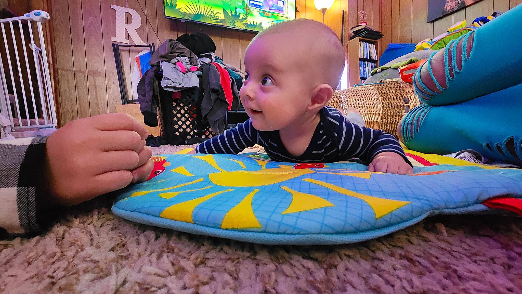 Jayce joined the competition — help win amazing prizes! arm, baby, baby_toddler_clothing, child, comfort, event, fun, games, happy, inflatable, leisure, person, play, recreation, room, sitting, smile, t_shirt, textile, toddler