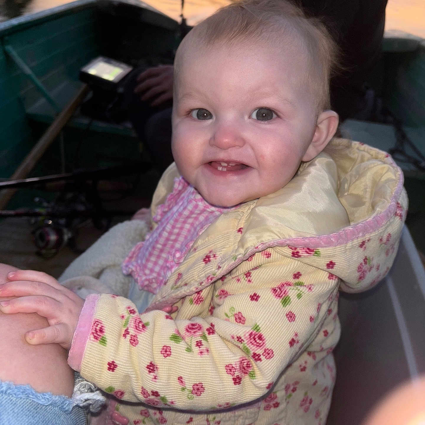 Etta joined the competition — help win amazing prizes! baby, boat, child, clothing, evening, face, floral_pattern, hand, happy, jacket, nature, outdoor, people, person, portrait, reflection, sitting, smiling, sunset, water