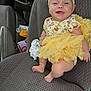 baby, infant, smiling, yellow_tutu, headband, winnie_the_pooh, car_seat, clothing, cute, happy, child, portrait, footwear, barefoot, person, indoor, seat, fabric, baby_girl, cute_outfit
