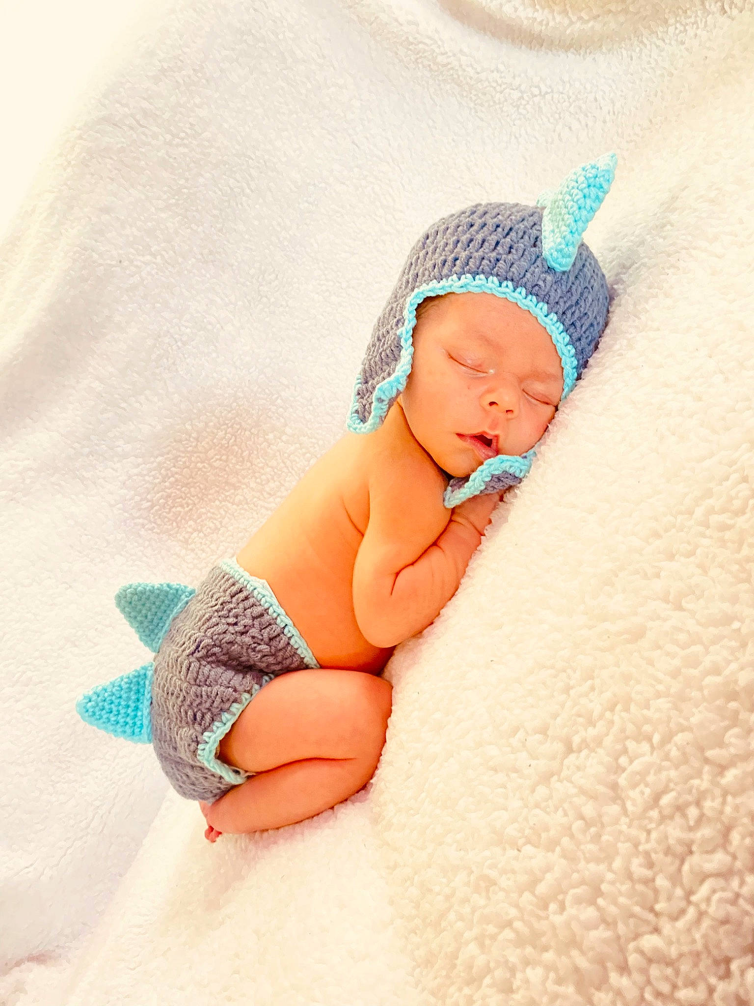 Joey joined the competition — help win amazing prizes! arm, baby, baby_sleeping, baby_toddler_clothing, cap, comfort, eye, face, finger, hand, head, headwear, human_body, human_leg, leg, linens, pattern, person, stomach, thigh