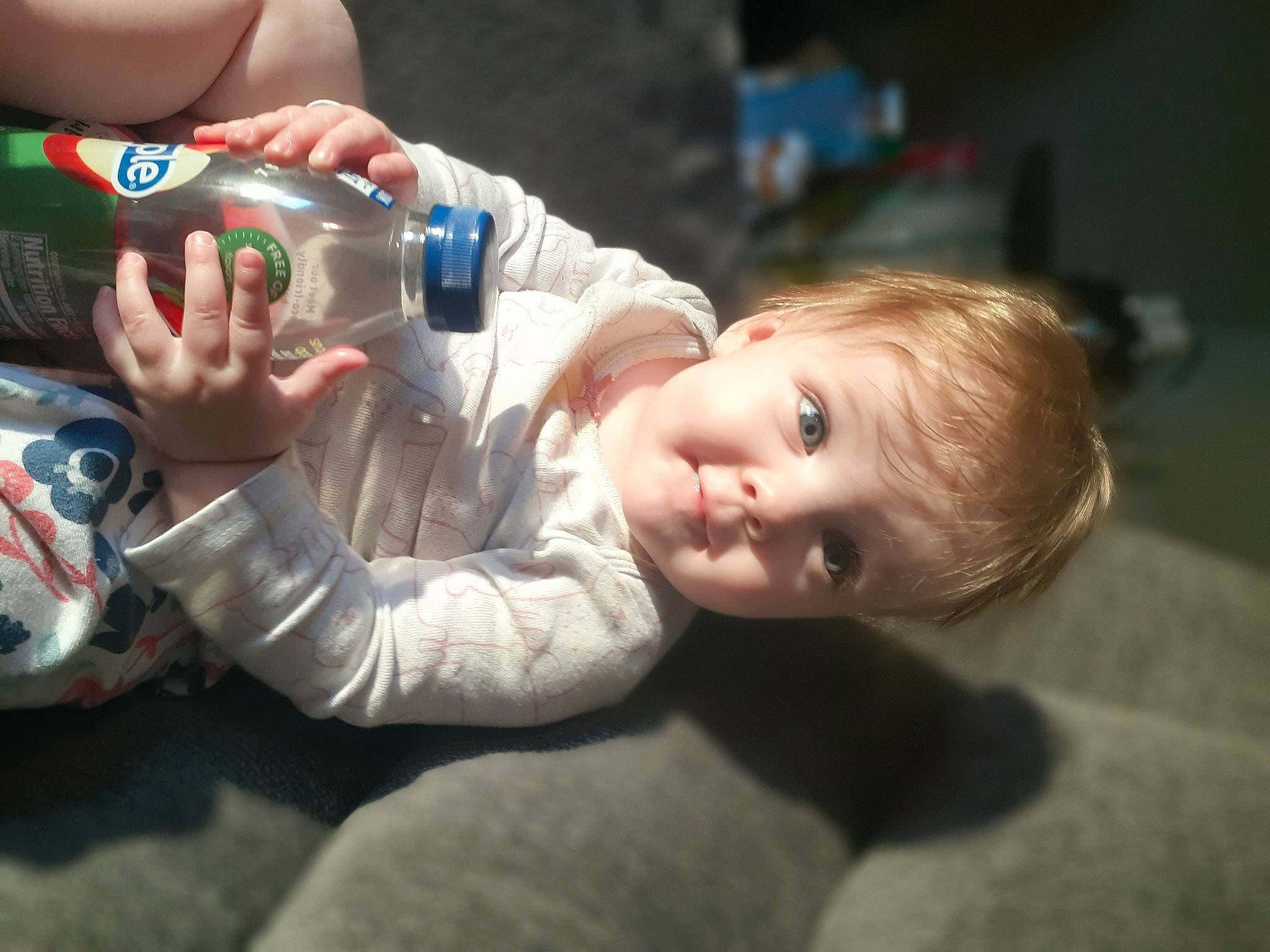 Sorriah joined the competition — help win amazing prizes! baby, bottle, cheek, drinking_water, drinkware, event, finger, flash_photography, fun, gesture, hand, happy, mouth, person, plastic_bottle, sitting, skin, smile, tin_can, toddler