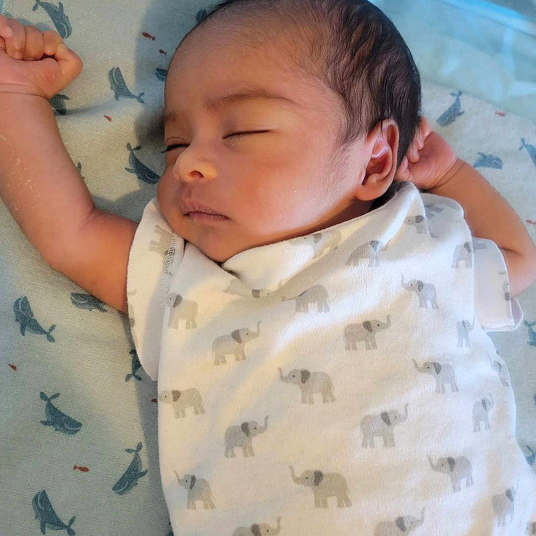 Zane Aezekiel joined the competition — help win amazing prizes! arm, baby, blanket, child, closeup, cute, elephant_pattern, hand, head, indoor, infant, onesie, peaceful, portrait, resting, skin, sleeping, soft_lighting, whale_pattern, young