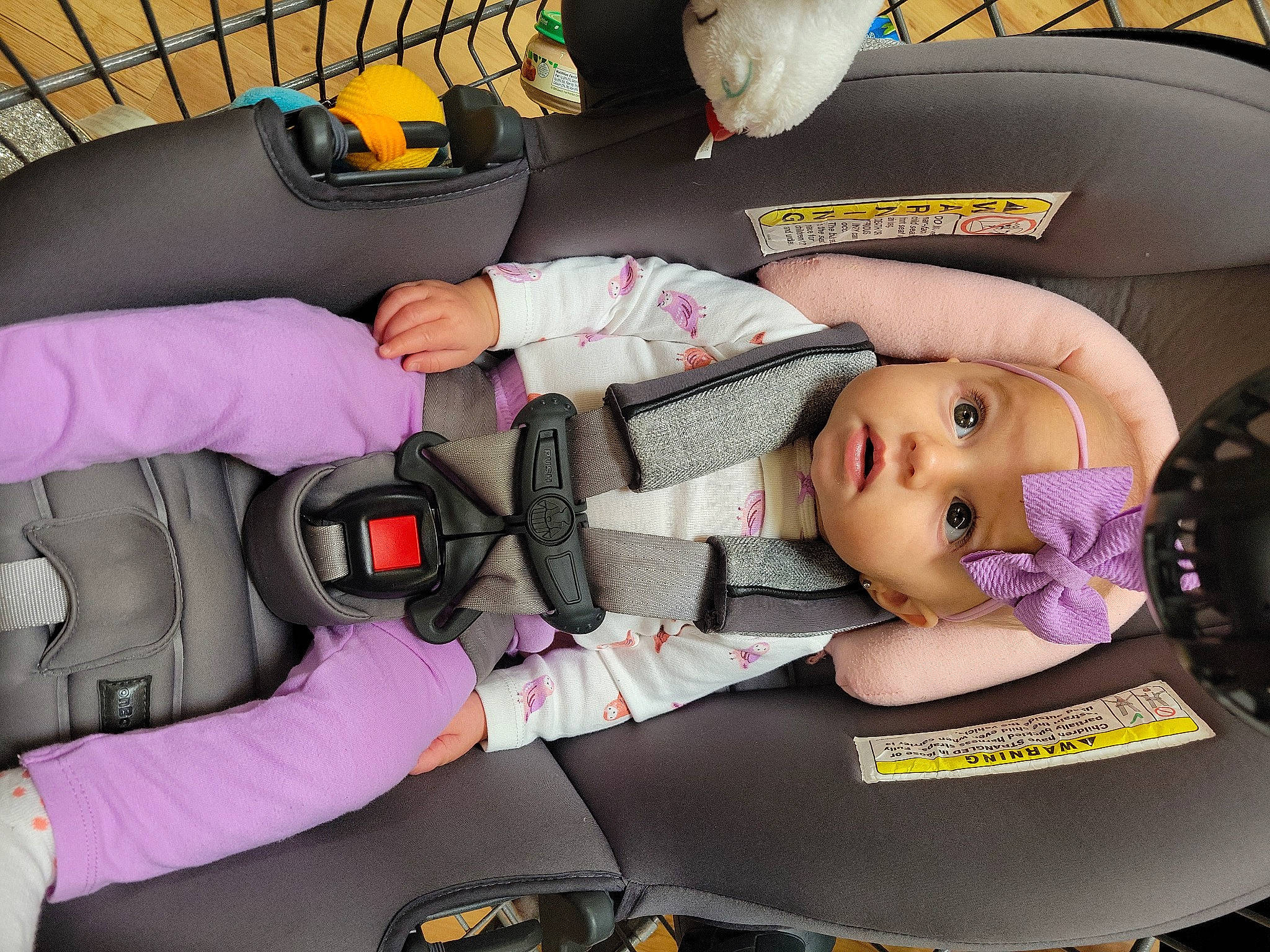 Isabel is registered to the contest to win money with this photo: auto_part, baby, baby_carriage, baby_in_car_seat, baby_products, baby_safety, car_seat, child, comfort, doll, finger, headwear, lap, mouth, person, personal_protective_equipment, product, toddler, toy, vertebrate
