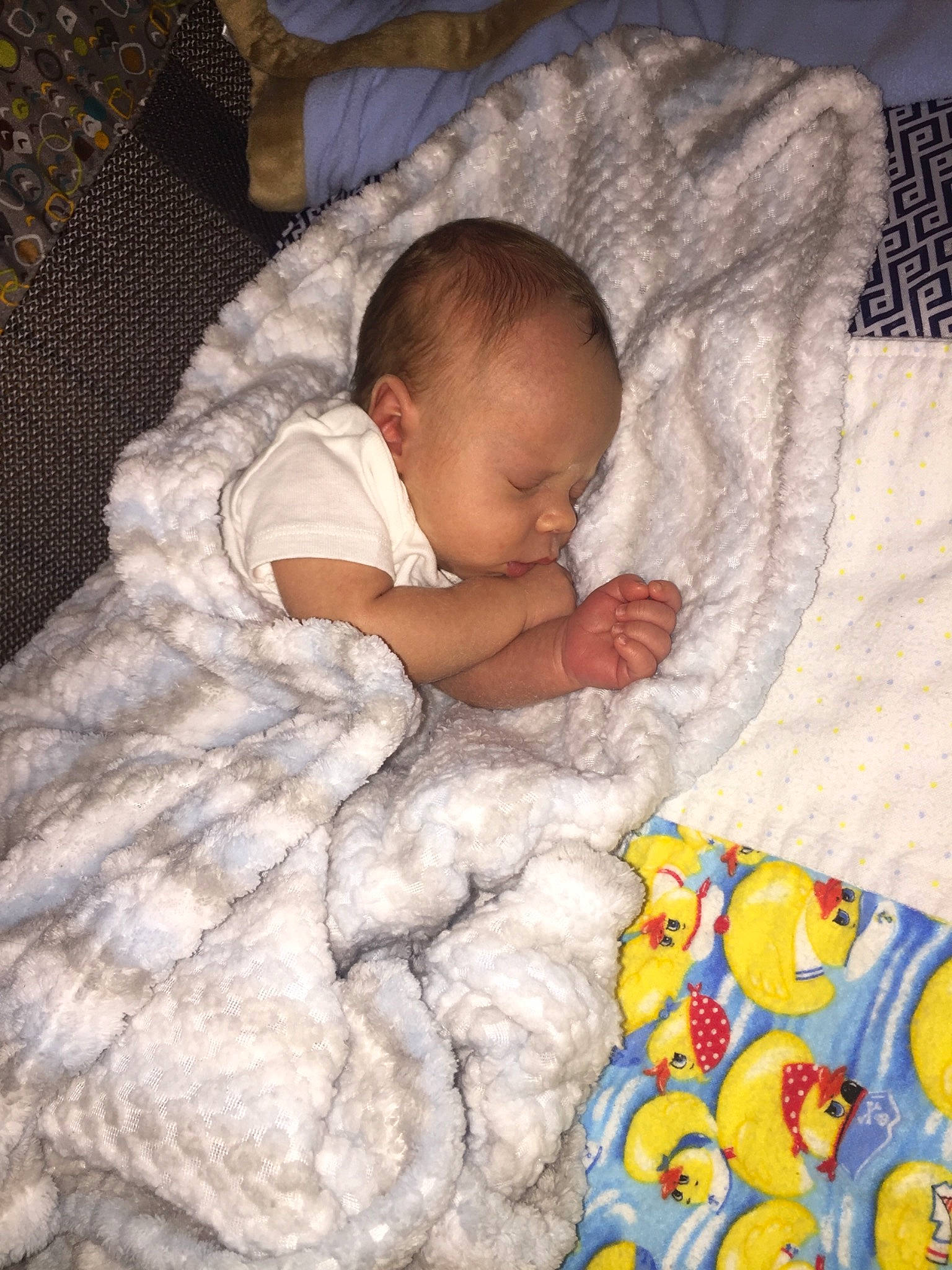 Jaxyn is registered to the contest to win money with this photo: baby, baby_sleeping, bedding, bedtime, blanket, child, comfort, linens, nap, person, product, sleep, textile, toddler