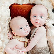 Dakota And Briggs joined the competition — help win amazing prizes! baby, basket, blue_eyes, closeup, cozy, cute, cuteness, expression, face, fur_blanket, holding_hands, indoors, infant, knitted_clothing, newborn, portrait, skin, sleeping_area, soft_texture, two_babies