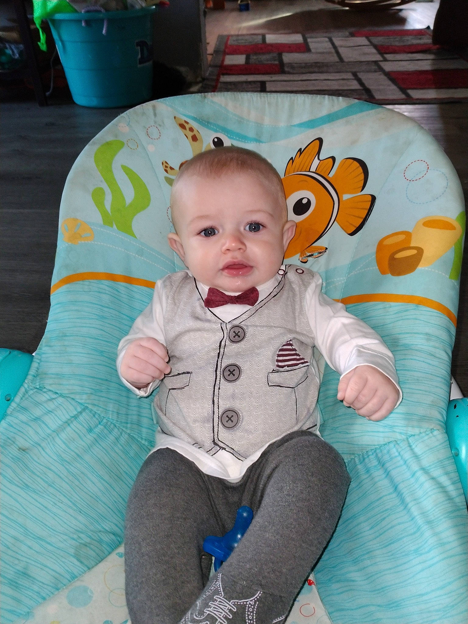 Asher is registered to the contest to win money with this photo: baby, baby_products, baby_toddler_clothing, chair, cheek, child, comfort, couch, eye, flowerpot, fun, green, happy, lap, linens, person, pink, sitting, sleeve, smile