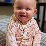 Mariska joined the competition — help win amazing prizes! baby, butterfly_pattern, buttoned_shirt, child, closeup, couch, curly_hair, cushion, cute, happy, home, indoor, infant, pacifier_clip, person, pink_clothing, portrait, sitting, smiling, soft_lighting