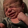 Dru joined the competition — help win amazing prizes! baby, newborn, face, expression, infant, clothing, camo, onesie, skin, head, hand, fist, lying_down, indoors, closeup, person, child, cute, sleepy, soft