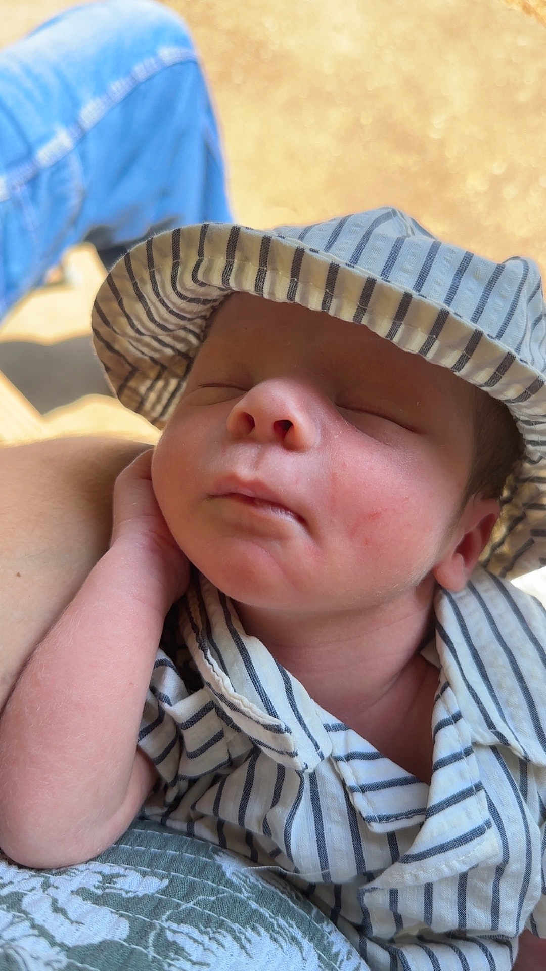 Dru joined the competition — help win amazing prizes! baby, sleeping, hat, striped_clothing, infant, peaceful, closeup, face, hand, newborn, skin, soft_light, portrait, resting, cute, child, casual, comfortable, outdoor, relaxation