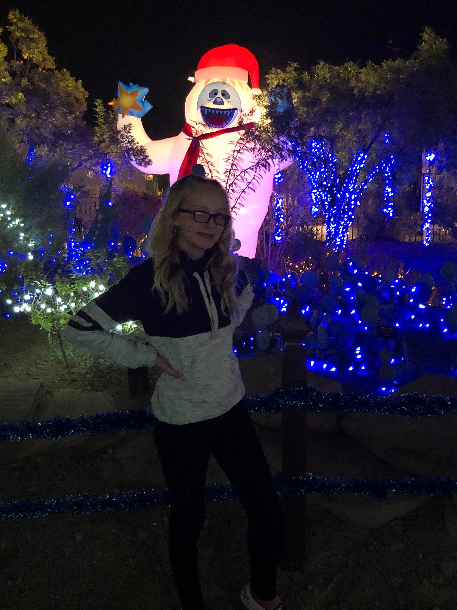 Brailee is registered to the contest to win money with this photo: blue, christmas, christmas_lights, costume, darkness, electric_blue, event, fun, holiday, interior_design, joy, light, lighting, midnight, night, person, photography, plant, space, tree