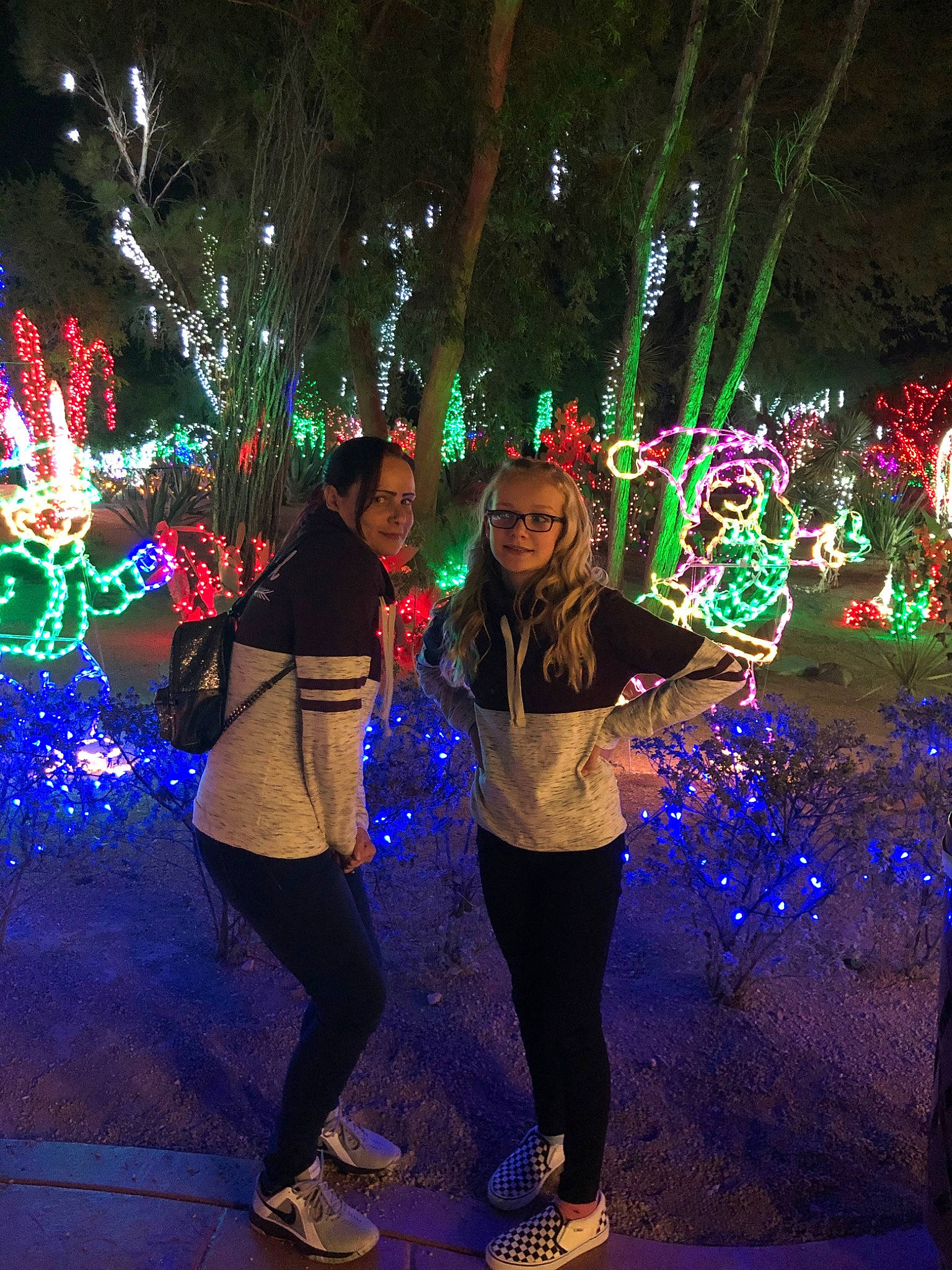 Brailee is registered to the contest to win money with this photo: christmas, christmas_decoration, christmas_lights, event, fete, fun, green, holiday, interior_design, leisure, light, light_emitting_diode, lighting, midnight, neon, night, person, plant, tree, world