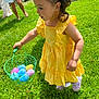 Jasmine joined the competition — help win amazing prizes! child, girl, yellow_dress, basket, plastic_eggs, grass, outdoor, sunlight, easter, happy, playing, summer, greenery, stone_wall, barefoot, crocs, curly_hair, person, spring, fun
