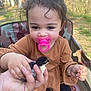 Jasmine joined the competition — help win amazing prizes! child, toddler, pacifier, cute, baby, animal, chick, bird, hand, outdoor, nature, grass, tree, person, seat, camouflage, clothing, brown, black, gentle
