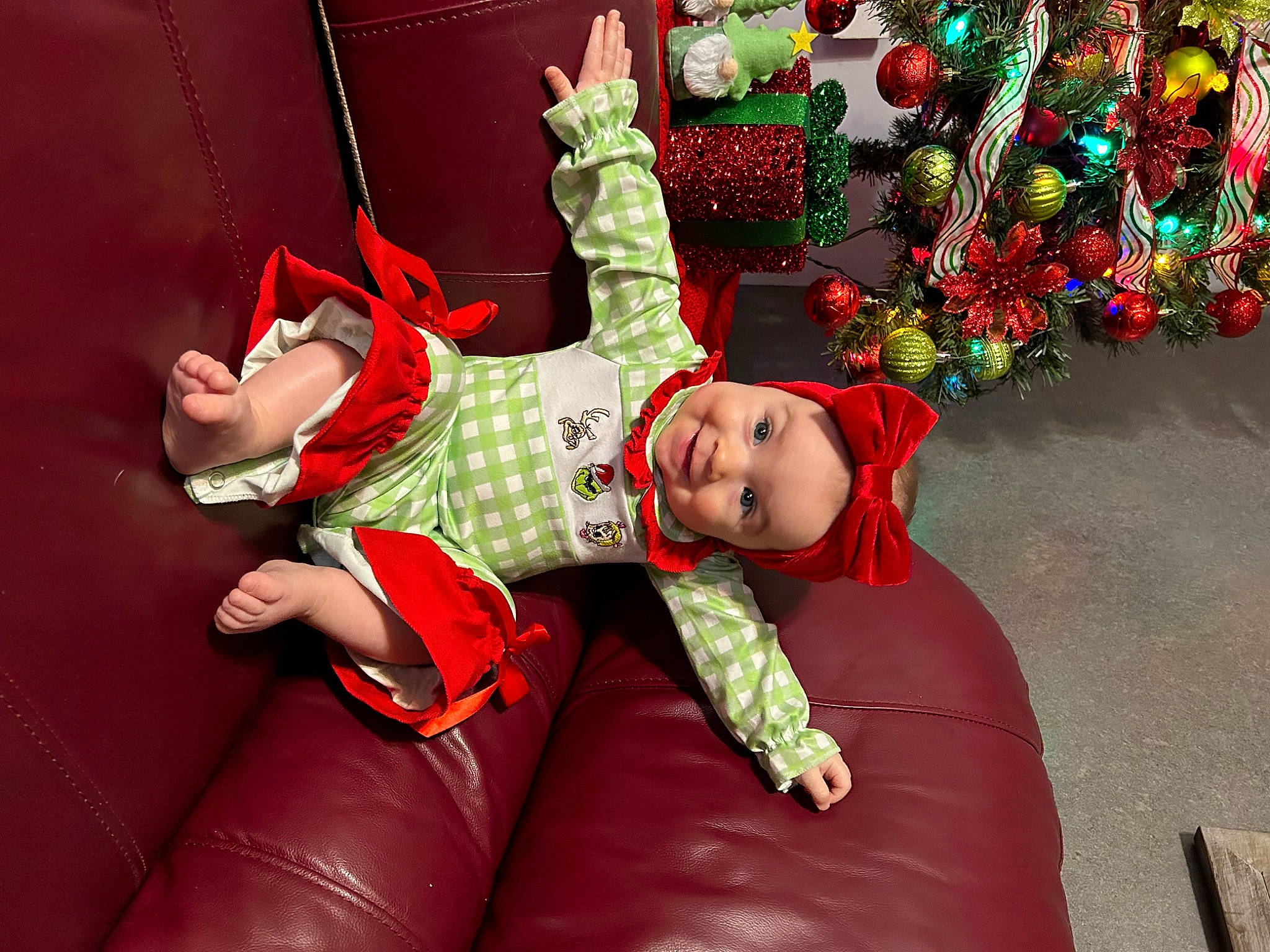 Jada joined the competition — help win amazing prizes! baby_toddler_clothing, carmine, child, christmas, christmas_decoration, christmas_eve, comfort, costume, event, fictional_character, fun, happy, hat, headwear, holiday, magenta, ornament, person, plant, toddler