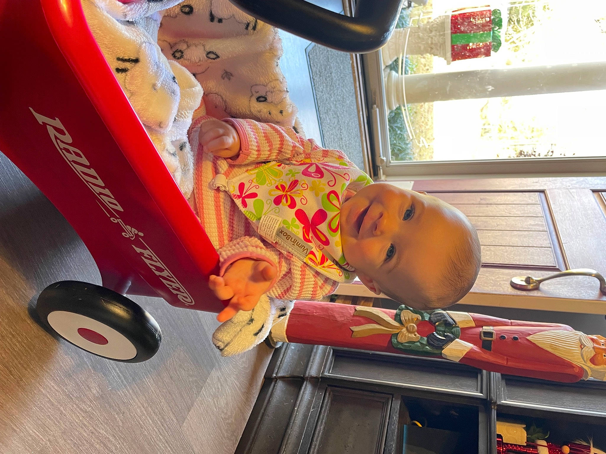 Jada is registered to the contest to win money with this photo: baby, child, fun, happy, hat, joy, leisure, magenta, person, room, smile, tire, toddler, toy, transport, vehicle, wheel