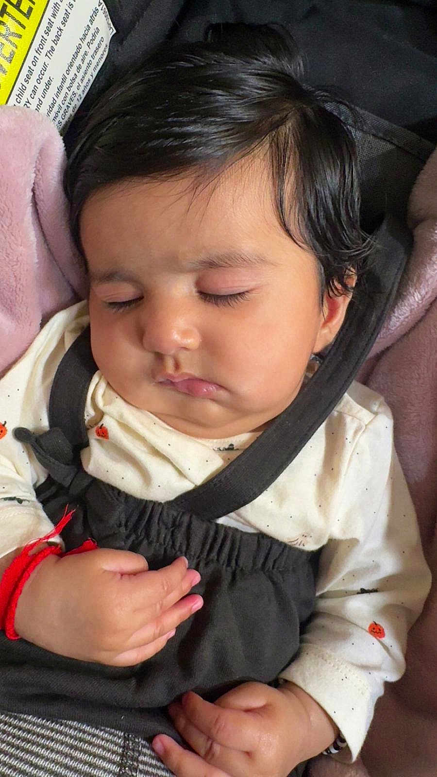 Aaira joined the competition — help win amazing prizes! baby, sleeping, car_seat, child, infant, face, hair, clothing, blanket, hand, peaceful, cute, safety_strap, indoors, closeup, portrait, soft, skin, young_child, resting