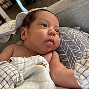 Francisco joined the competition — help win amazing prizes! baby, infant, blanket, bee_pattern, cushion, indoor, closeup, face, skin, tongue, comfort, resting, soft, newborn, child, person, cute, young, cozy, pattern