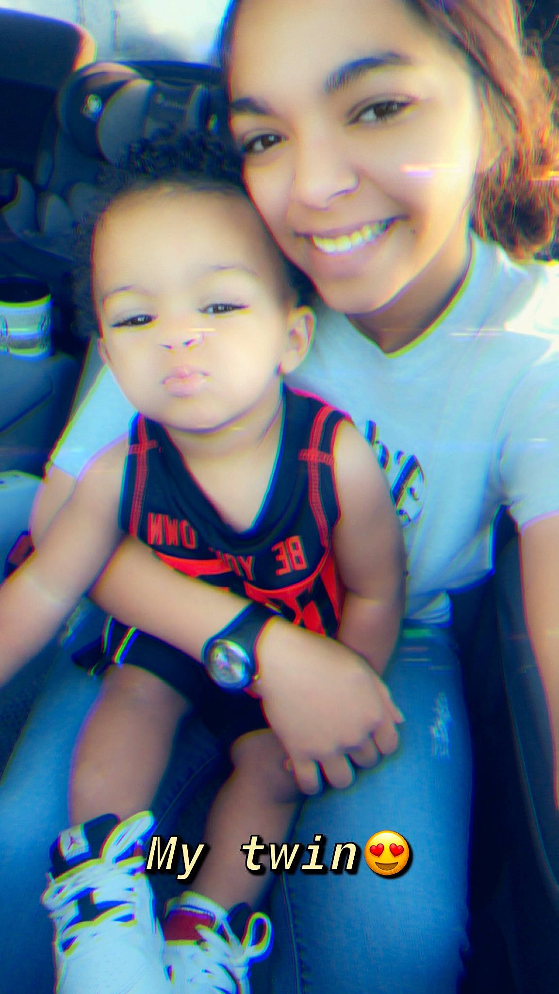 Judson is registered to the contest to win money with this photo: black_hair, blue, cheek, child, cool, eye, facial_expression, finger, friendship, fun, happy, hug, interaction, iris, joy, mother, person, photography, sibling, skin