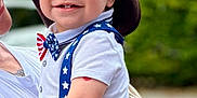 Brooks joined the competition — help win amazing prizes! adult, baby, blue_pants, bowtie, child, closeup, cowboy_hat, cute, greenery, hand, happy, hat, outdoor, person, portrait, smiling, suspenders, tattoo, toddler, white_shirt