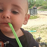 Jameson joined the competition — help win amazing prizes! baby, child, face, straw, cup, hand, outdoor, trees, yard, blue, green, nail_polish, person, toddler, summer, drink, closeup, nature, daylight, cute