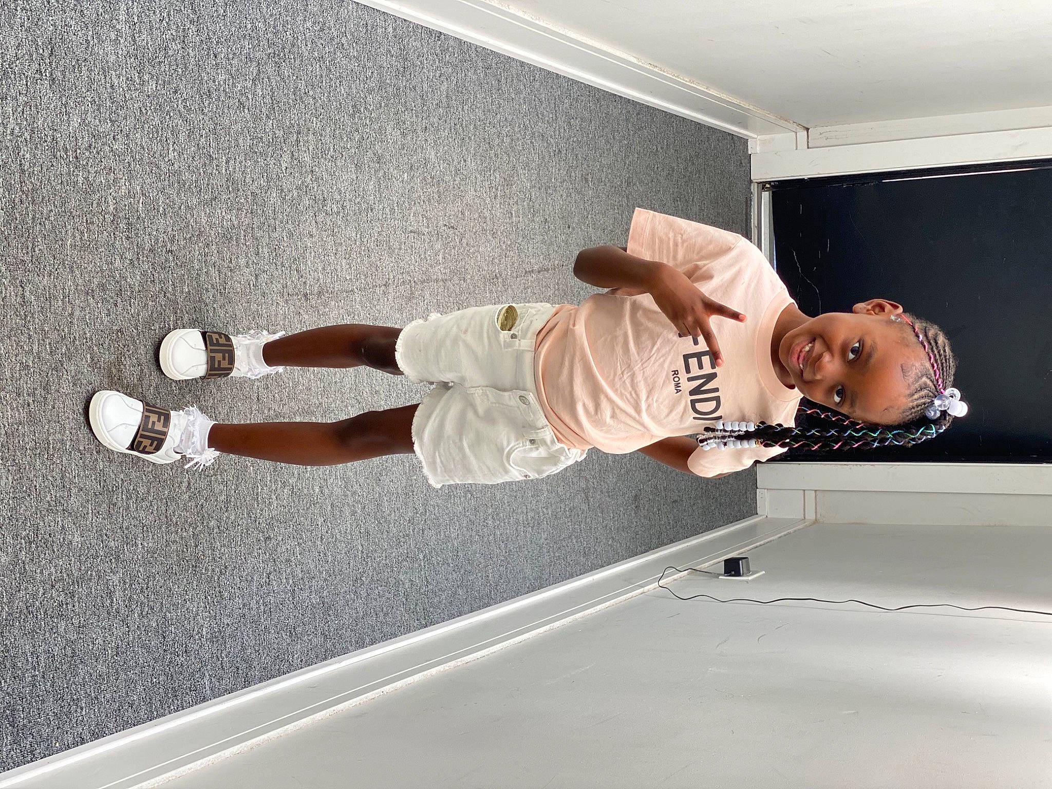 Ramiya Smith is registered to the contest to win money with this photo: building, ceiling, comfort, elbow, floor, flooring, hand, hardwood, human_body, joint, joy, knee, leg, person, sneakers, standing, t_shirt, thigh, walking_shoe, wall