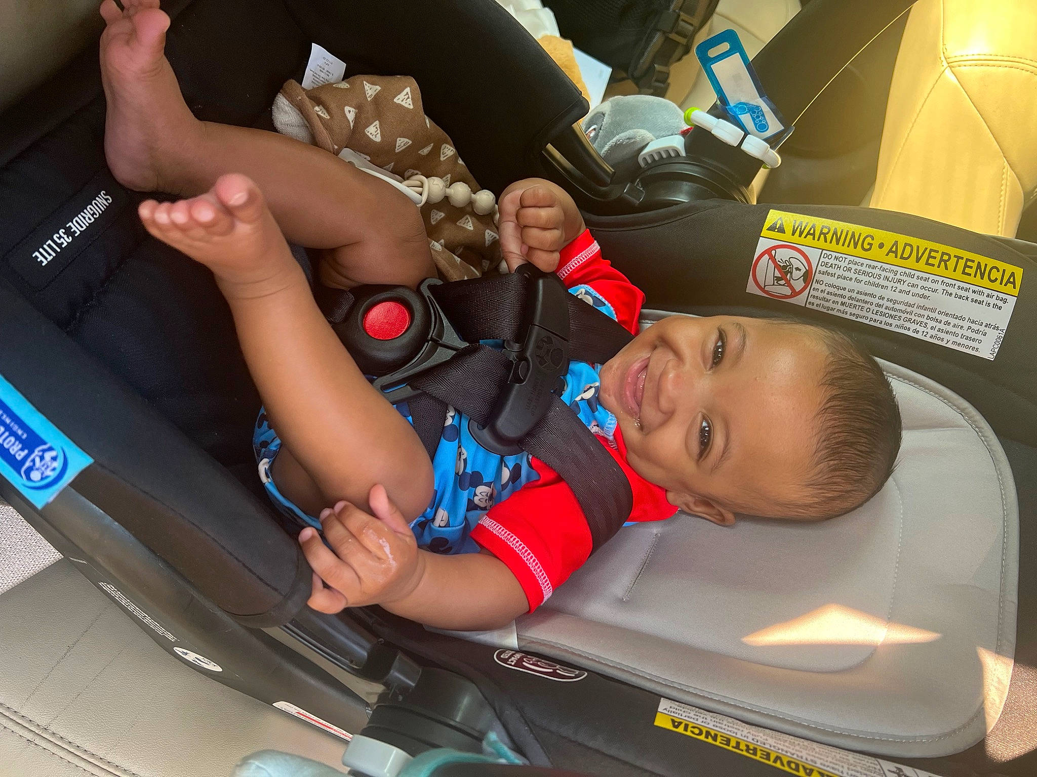 Jace is registered to the contest to win money with this photo: auto_part, automotive_design, automotive_exterior, automotive_tire, bumper, car, car_seat, family_car, fun, hood, joy, leisure, motor_vehicle, person, smile, t_shirt, thigh, toddler, trunk, vehicle