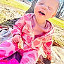 baby, child, pink_clothing, heart_pattern, outdoor, sunlight, smiling, happy, eating, blanket, tree, grass, sandwich, playtime, nature, cute, toddler, casual, daytime, fun
