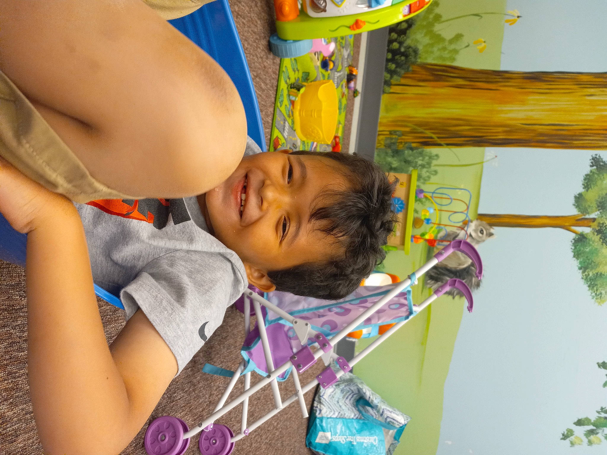 Bobby is registered to the contest to win money with this photo: adaptation, barechested, chest, child, event, fun, happy, joy, leisure, people_on_beach, person, pole, recreation, smile, snapshot, summer, t_shirt, toddler, tree, visual_arts