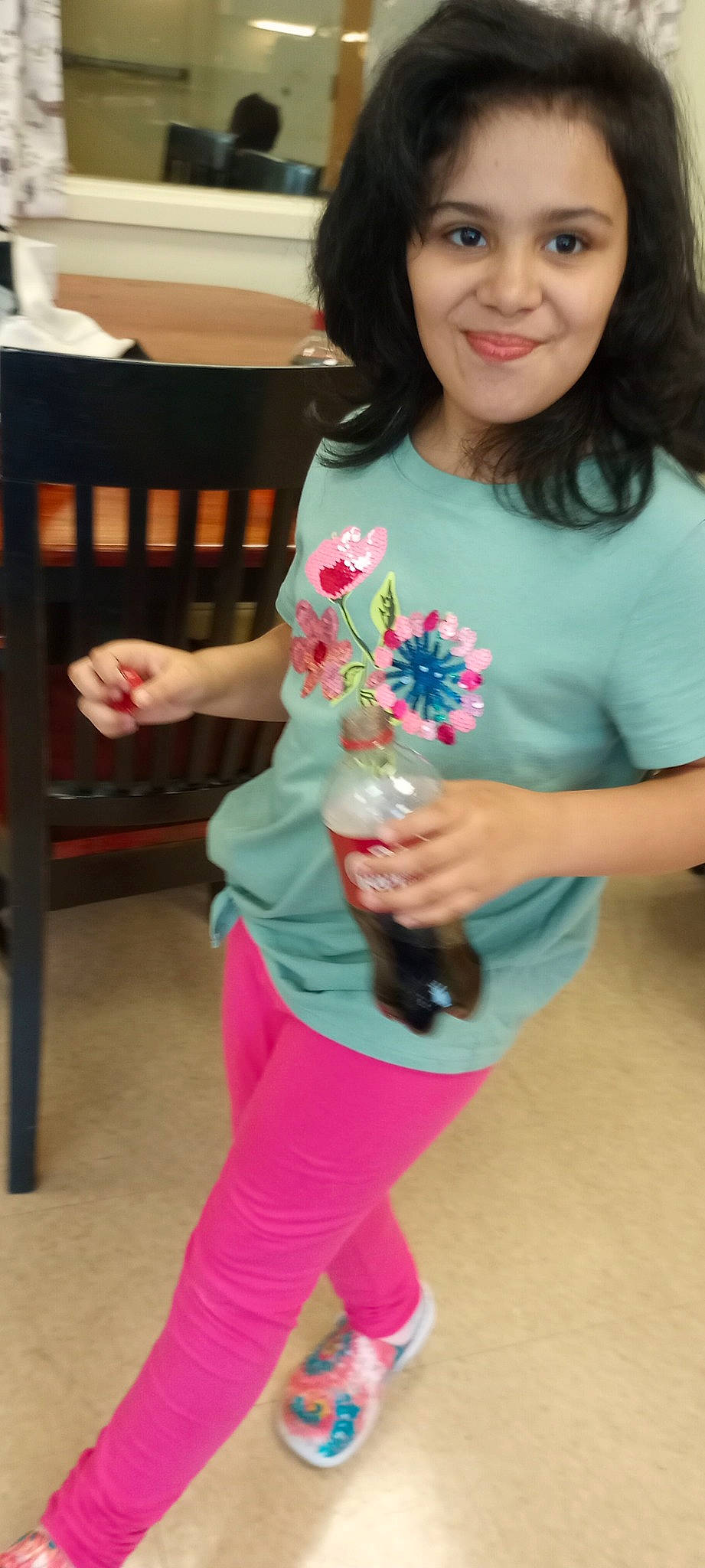 Sarah joined the competition — help win amazing prizes! black_hair, bottle, clothing, drinkware, facial_expression, finger, happy, human_body, joint, joy, neck, person, pink, red, shoulder, skin, sleeve, smile, thigh, trunk