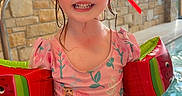 Brooklynn joined the competition — help win amazing prizes! child, swimming_pool, goggles, floaties, pink_swimsuit, princess_characters, indoor_pool, tiled_floor, stone_wall, water, smiling, wet_hair, playful, sparkles, safety, fun, summer, water_fun, young_child, happy