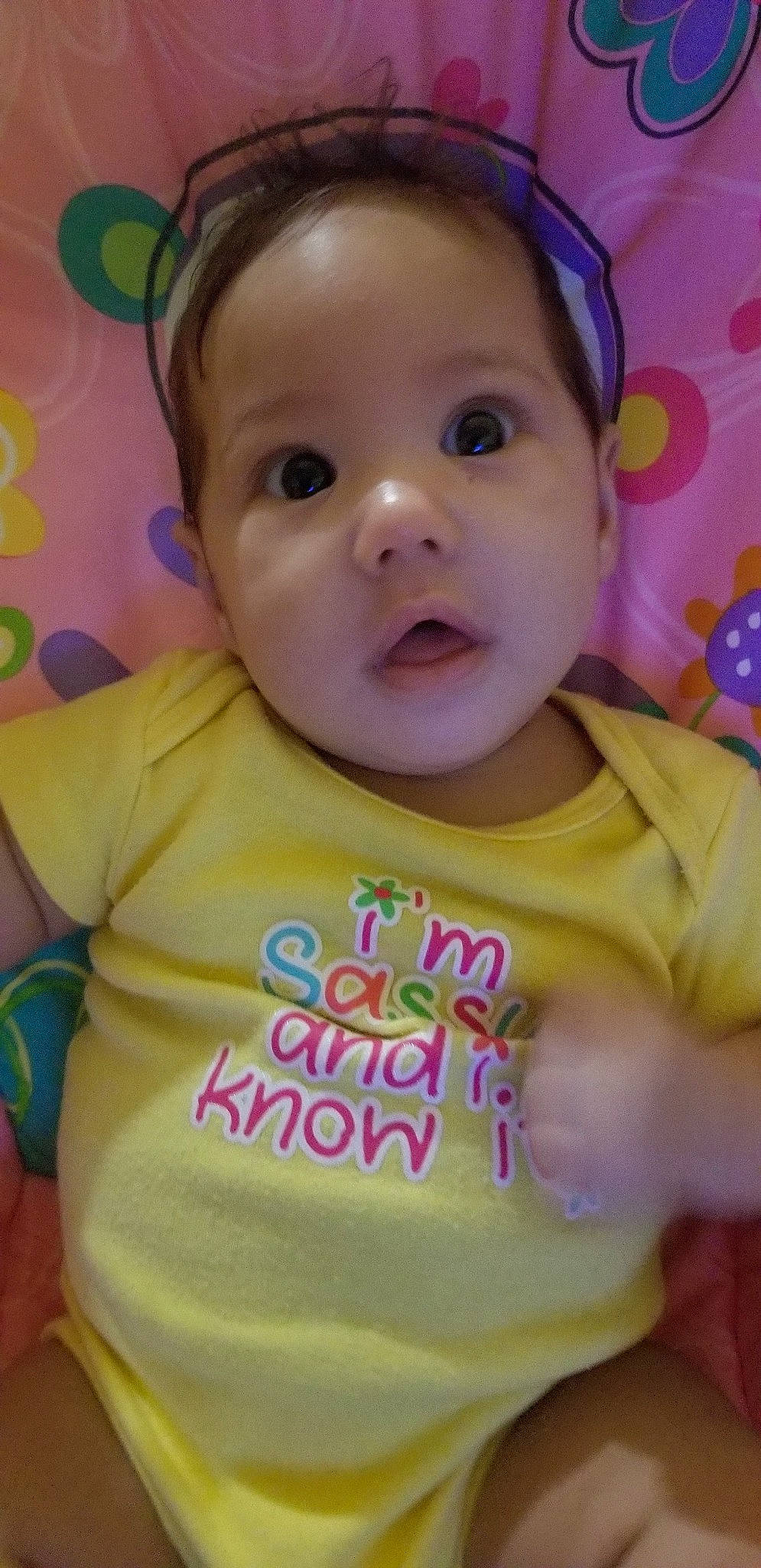 Raven is registered to the contest to win money with this photo: baby, baby_toddler_clothing, cheek, child, chin, face, facial_expression, forehead, fun, happy, head, lip, mouth, nose, person, pink, skin, smile, surprise, toddler