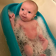 Weston joined the competition — help win amazing prizes! baby, bathtub, bubble_bath, water, foam, infant, child, skin, bathroom, cleaning, cute, relaxing, sitting, young, person, head, face, pink_skin, teal, bath