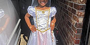Treasure is registered to the contest to win money with this photo: adult, bride, child, clothing, costume, dress, eveningdress, face, fashion, female, formalwear, girl, hat, head, path, person, photography, portrait, wedding, woman