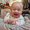 Kensleigh joined the competition — help win amazing prizes! baby, smile, laughing, infant, cushion, patterned_fabric, lamp, home_interior, curtains, clothing, person, face, happy, coats, furniture, living_room, head, hand, joy, cute