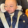 toddler, child, baby, jacket, coat, car_seat, seatbelt, toy, orange, face, expression, curious, warm_clothing, indoor, closeup, person, portrait, smile, young, safety
