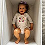 toddler, child, girl, onesie, bow, purple_bow, box, white_box, feet, barefoot, smiling, looking_at_camera, indoors, carpet, cute, clothing, casual, portrait, happy, baby