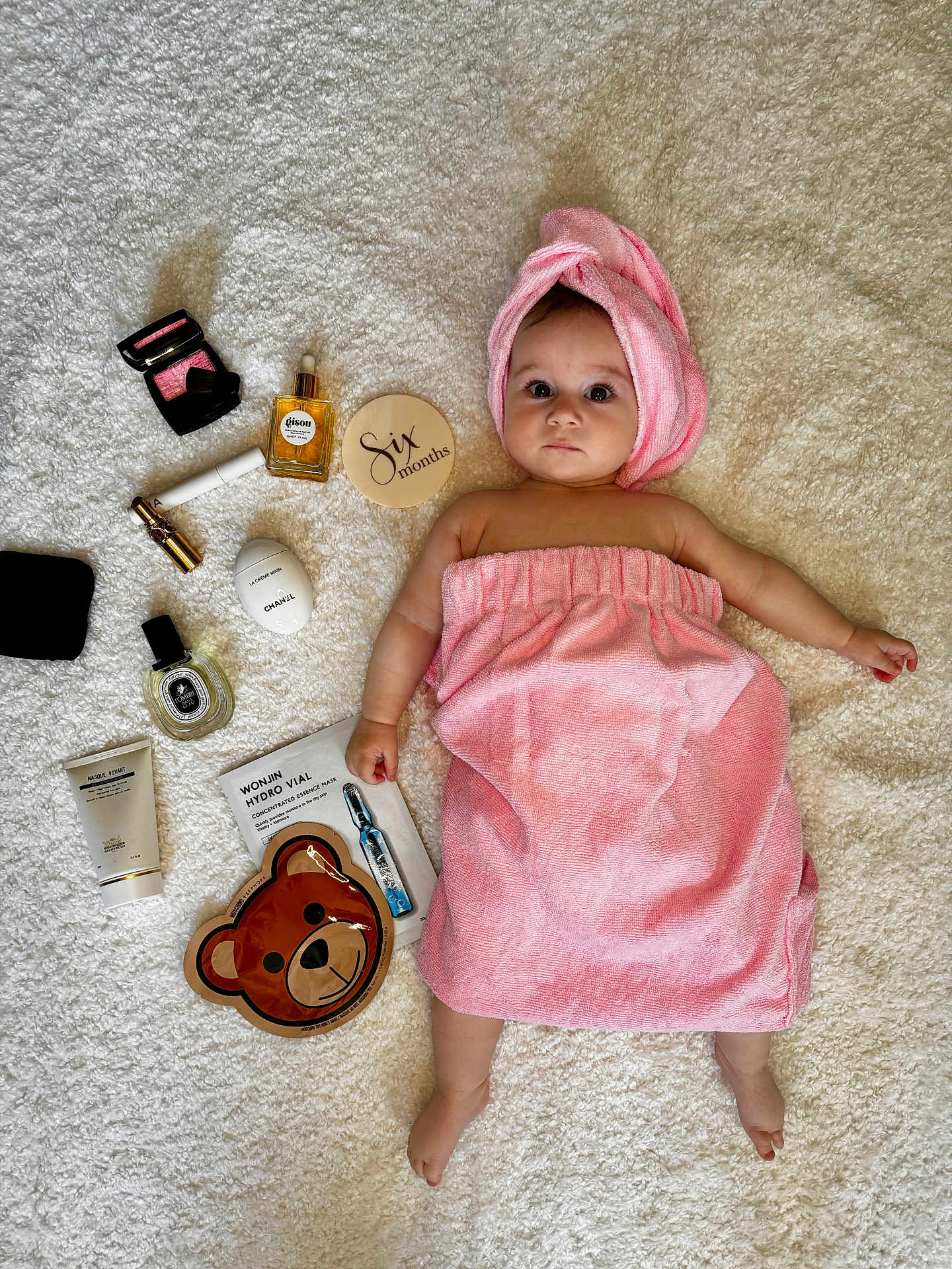 Aelita Misha joined the competition — help win amazing prizes! baby, infant, pink_towel, towel_turban, skincare_products, beauty_products, face_mask, bear_face_mask, white_blanket, milestone, six_months, cute, portrait, laying_down, baby_skin, cosmetics, child, soft_texture, adorable, curious