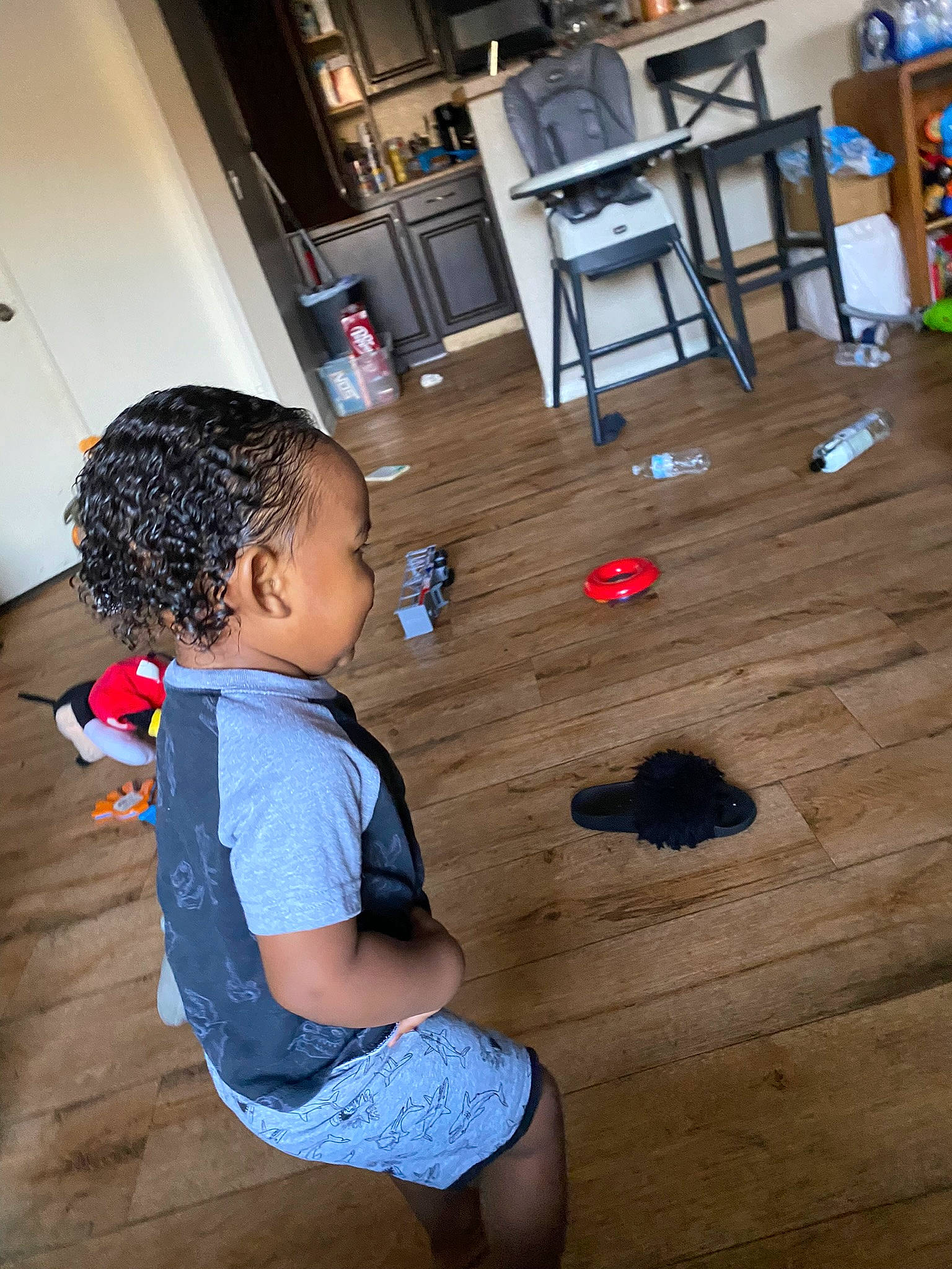 Malakai joined the competition — help win amazing prizes! baby_toddler_clothing, black, child, floor, flooring, fun, happy, hardwood, human_leg, leisure, person, photograph, shorts, snapshot, standing, t_shirt, table, toddler, varnish, wood