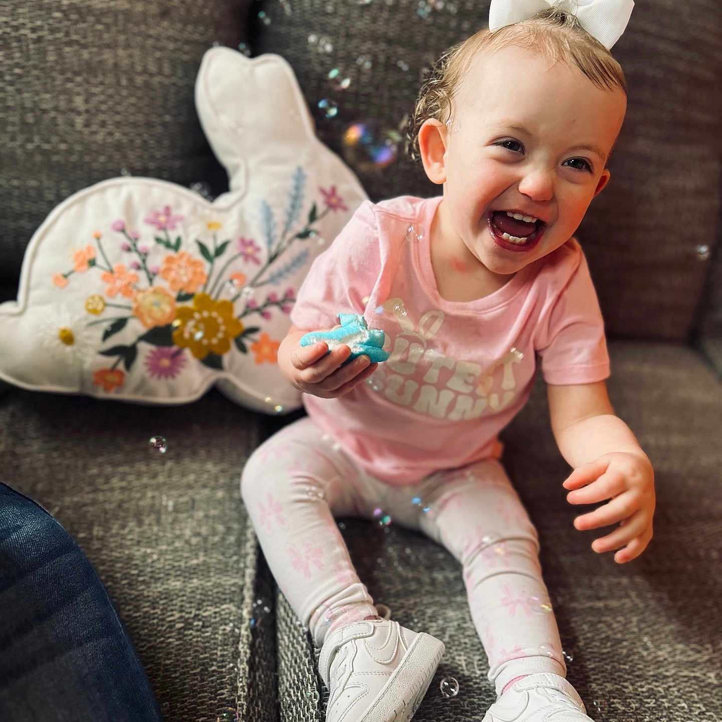 Braelyn is registered to the contest to win money with this photo: baby, babylaughing, clothing, couch, cushion, face, footwear, furniture, happy, head, homedecor, jeans, laughing, pants, person, photography, portrait, shoe, sitting, smile