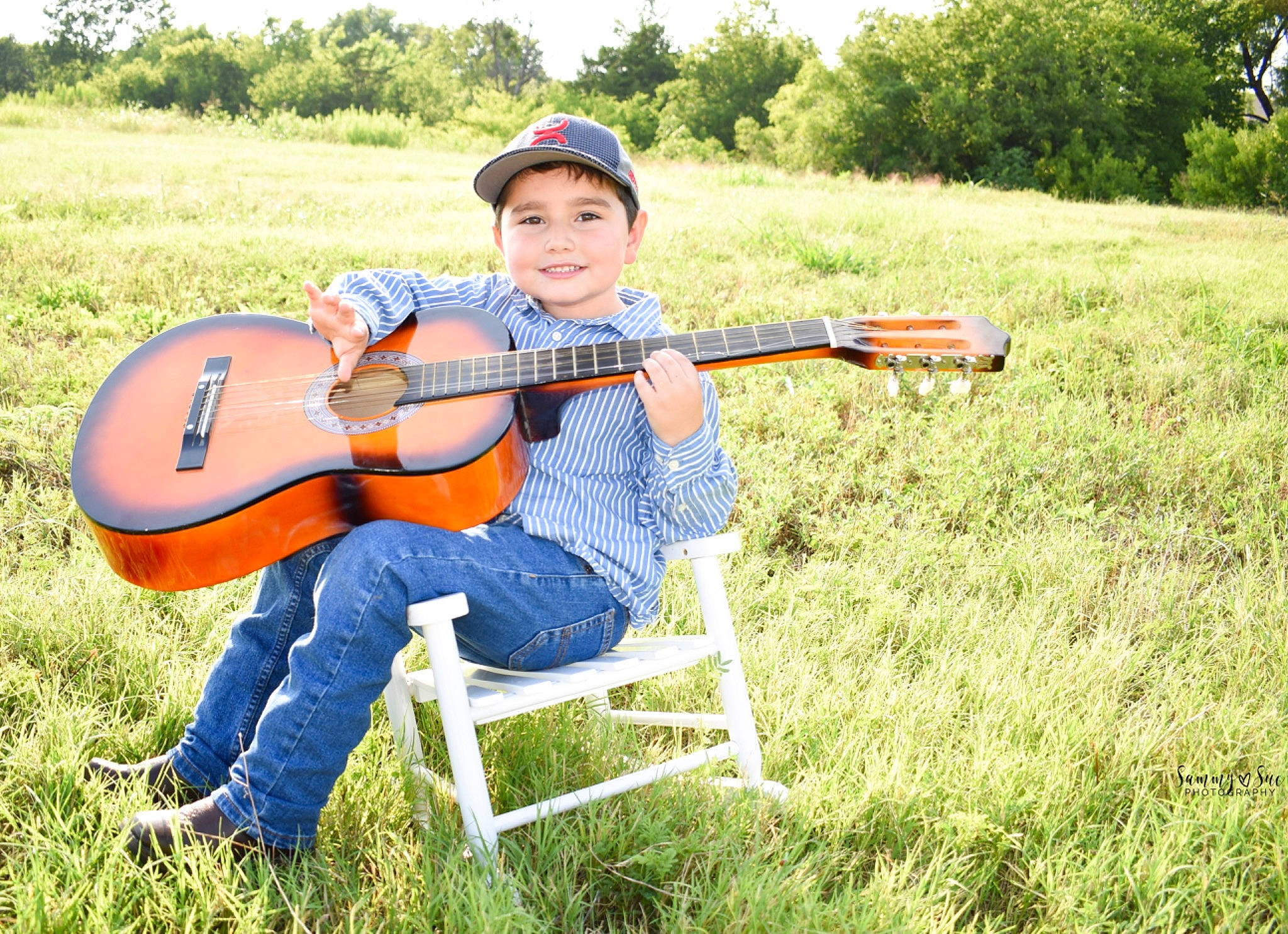 Braiden joined the competition — help win amazing prizes! acoustic_guitar, cavaquinho, grass, grassland, guitar, headwear, joy, landscape, meadow, musical_instrument, musician, person, plucked_string_instruments, recreation, string_instrument, ukulele