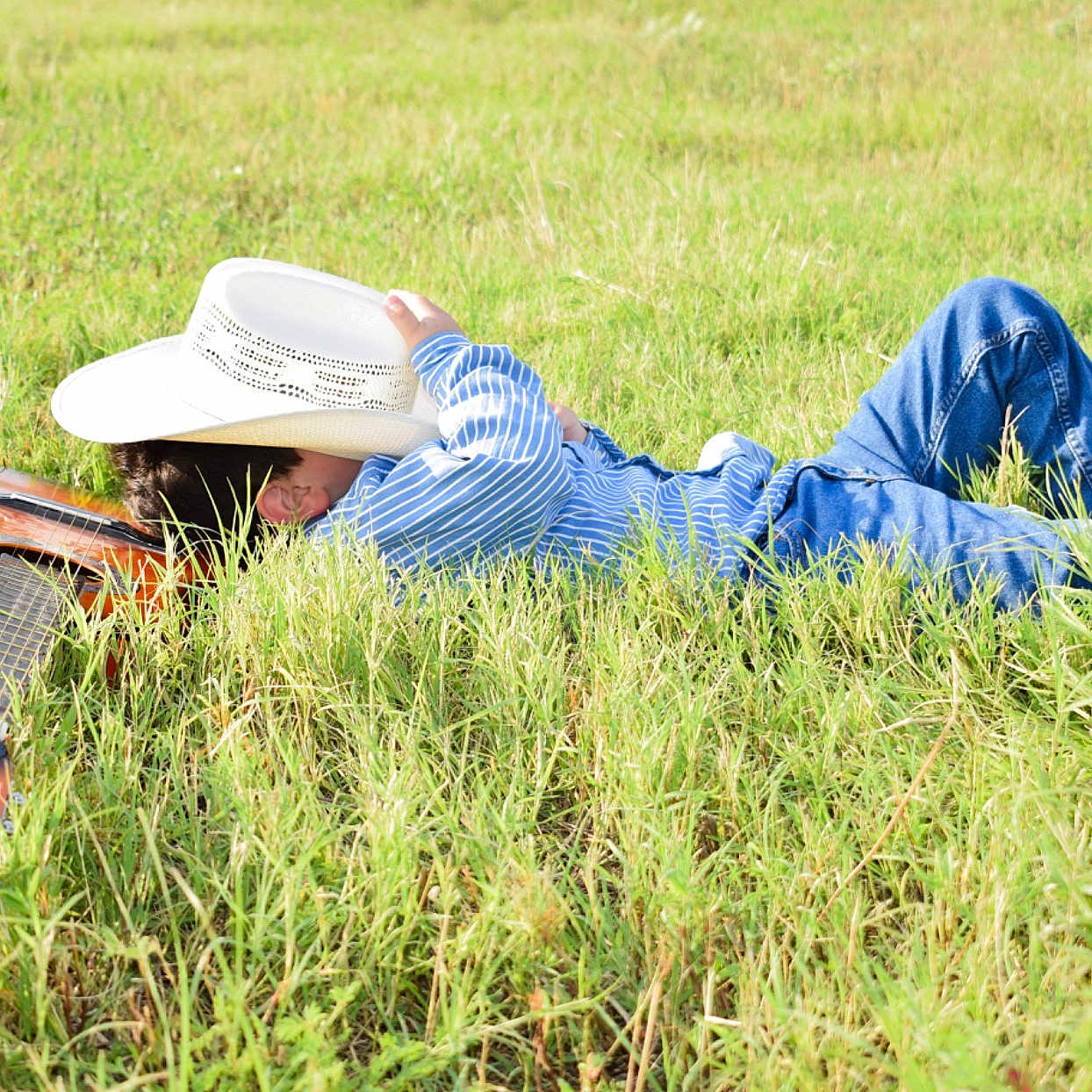 Braiden joined the competition — help win amazing prizes! agriculture, field, grass, grass_family, grassland, meadow, paddy_field, people_in_nature, plant, plant_community, prairie, reading, wildflower