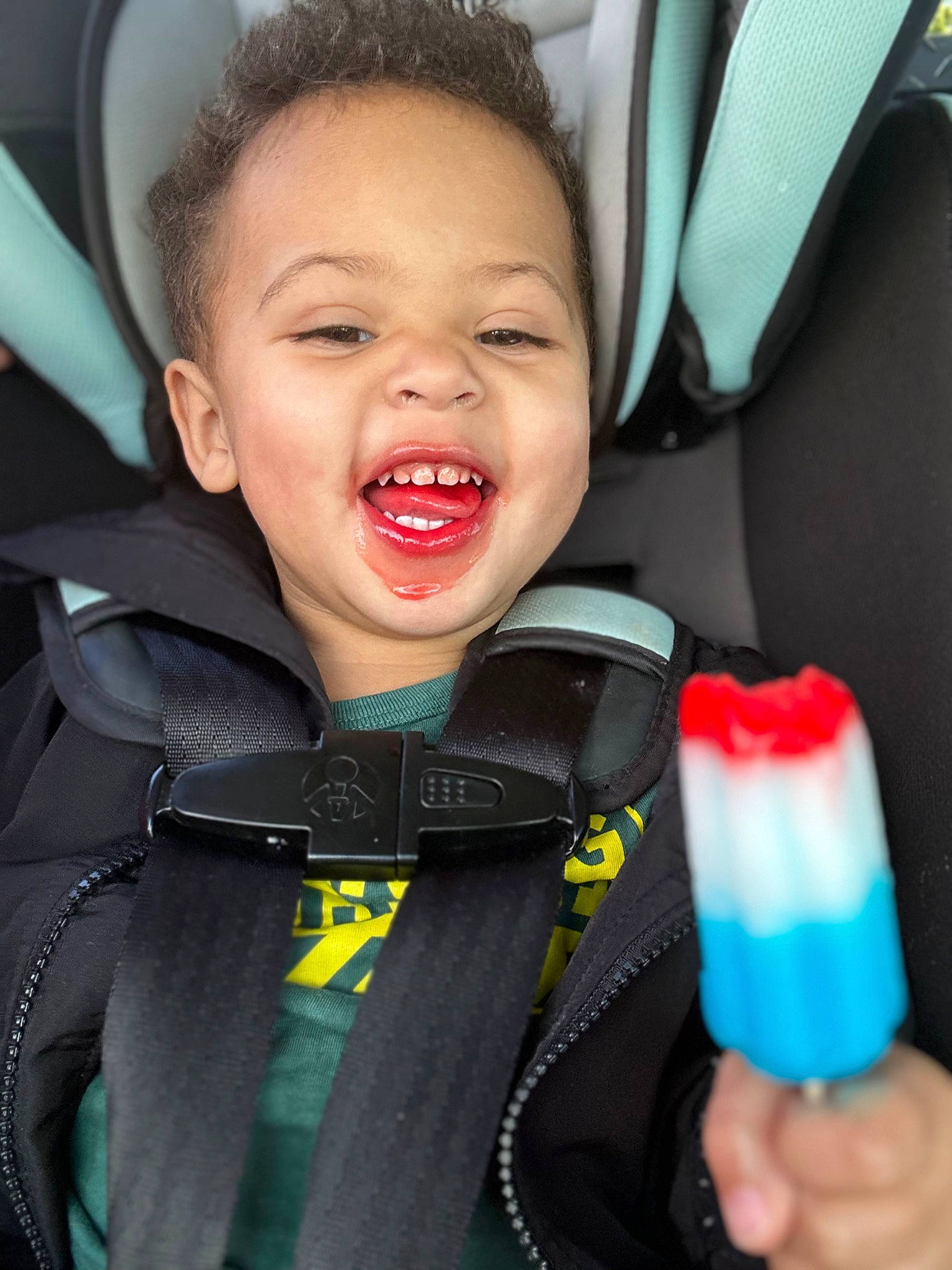 Malaki joined the competition — help win amazing prizes! auto_part, automotive_design, car, car_seat, car_seat_cover, child, comfort, electric_blue, family_car, fun, happy, head_restraint, motor_vehicle, person, product, seat_belt, smile, steering_wheel, toddler, vehicle