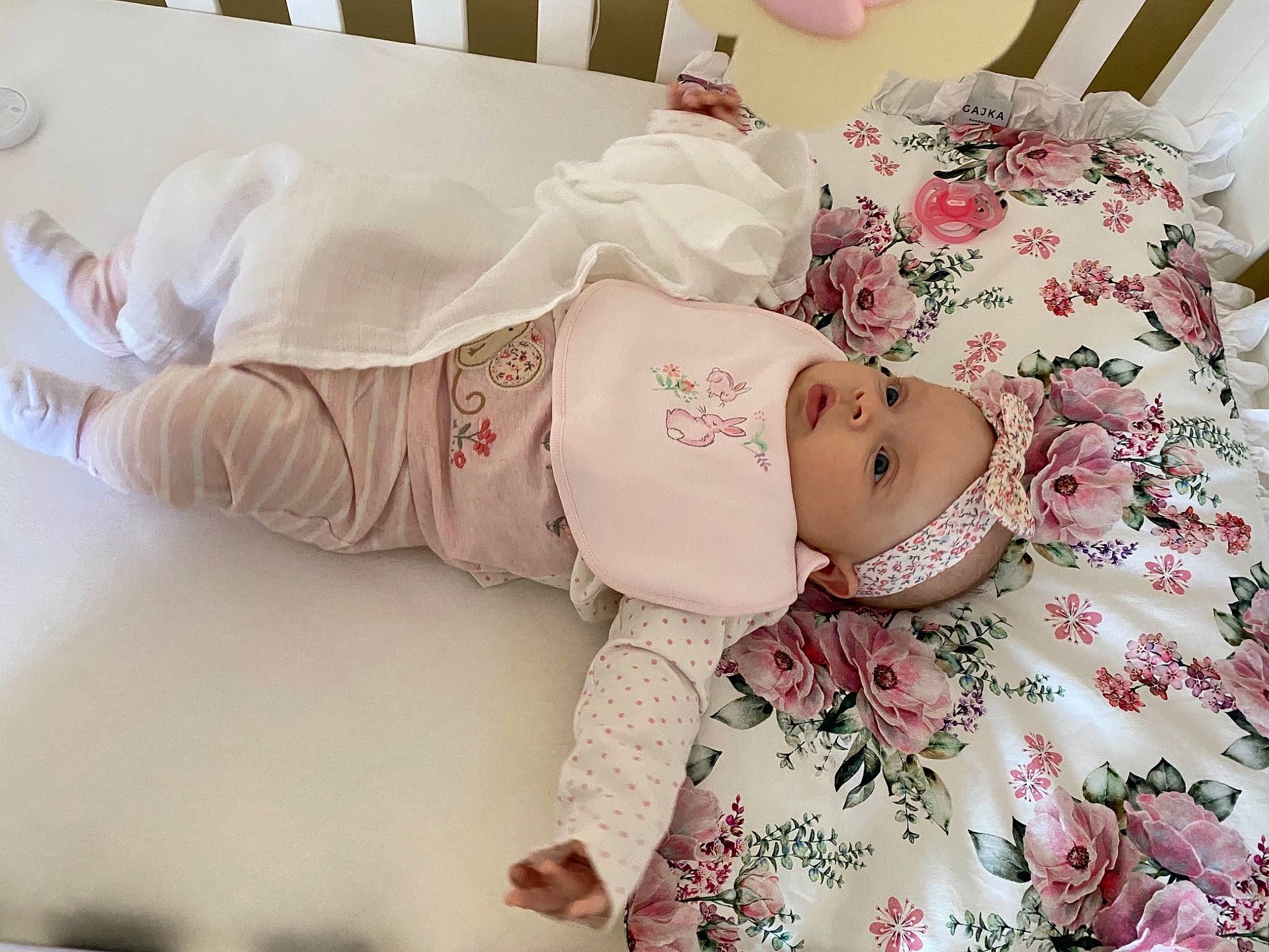 Lilia joined the competition — help win amazing prizes! arm, baby, baby_products, baby_sleeping, baby_toddler_clothing, bedding, child, comfort, eye, hand, head, headwear, human_body, leg, linens, pattern, person, pink, room, skin