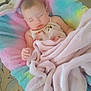 baby, blanket, sleeping, cushion, colorful, pastel, soft, cozy, indoor, child, carpet, face, peaceful, resting, cute, infant, comfort, fabric, home, toddler