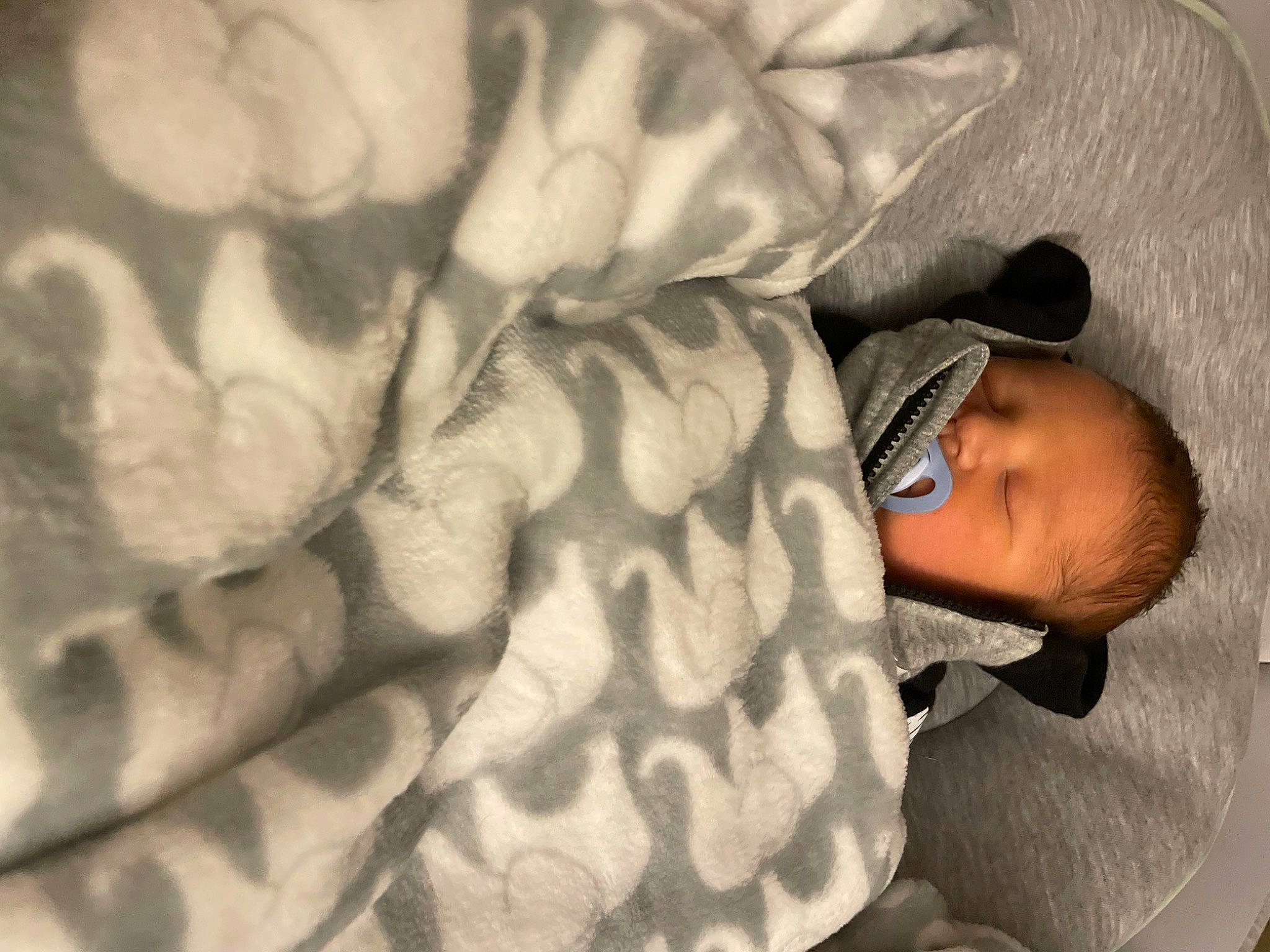 Bryson joined the competition — help win amazing prizes! baby, baby_products, baby_sleeping, baby_toddler_clothing, bedtime, child, comfort, flooring, fur, gesture, head, headgear, human_leg, linens, outerwear, pattern, person, petal, sitting, thumb