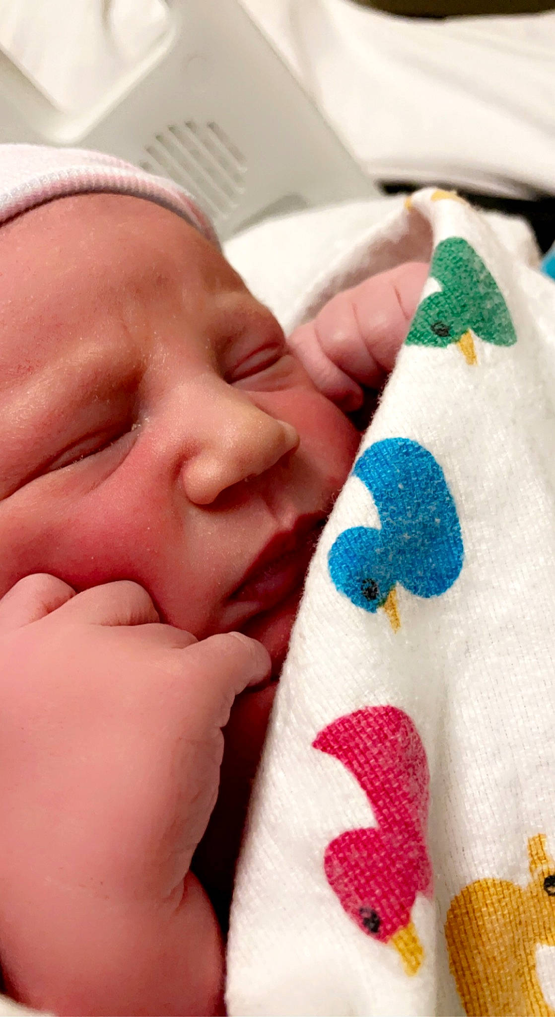 Bryson is registered to the contest to win money with this photo: baby, child, close_up, comfort, eyelash, finger, foot, gesture, hand, human_leg, linens, mouth, nail, nose, organ, person, skin, sock, thumb, toddler